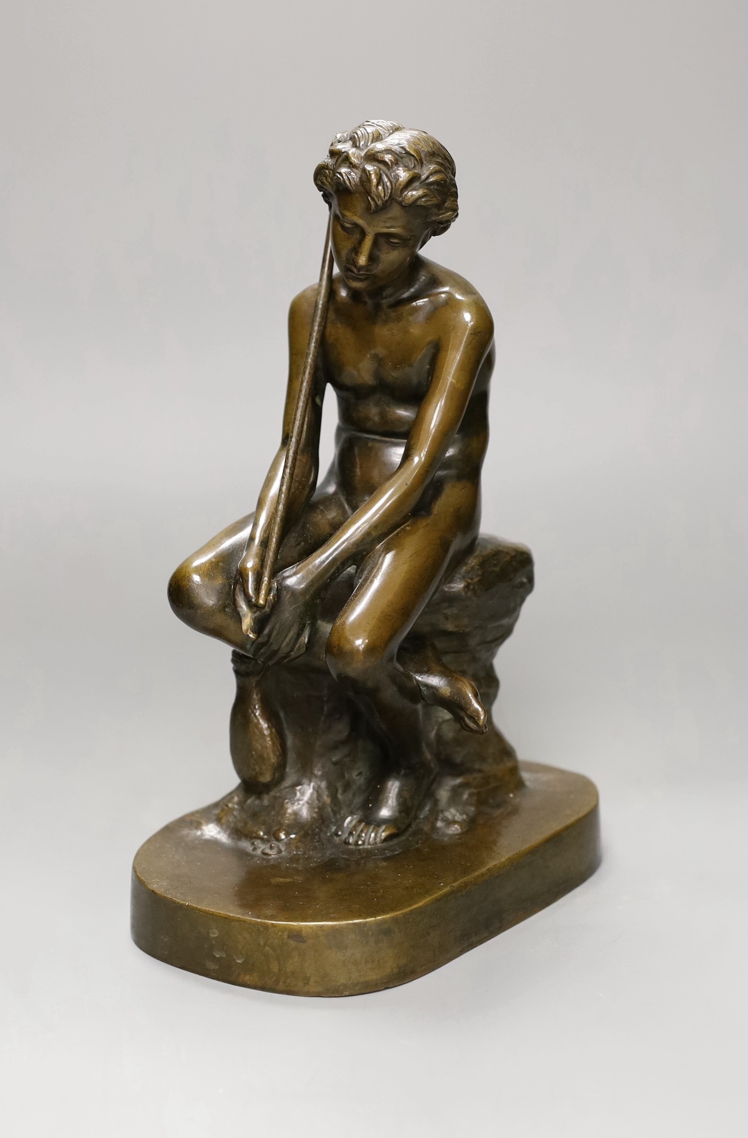 An early 20th century bronze figure of a fisherboy, 25cm